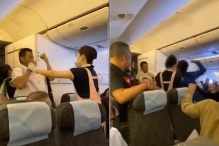 Eva Air flight attendants break up fight between two men on plane
