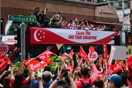 Thousands cheer on Paralympians in celebratory bus parade