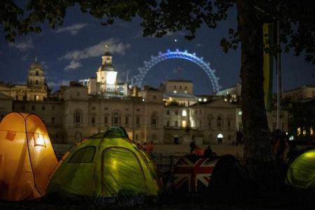 'We couldn't miss this': Thousands camp out for Queen Elizabeth's funeral