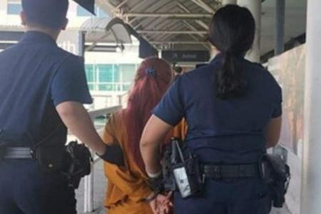 Woman nabbed on Indonesia-bound ferry after allegedly pouring hot water on husband