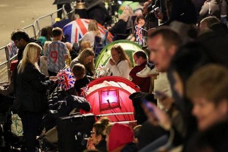 'We couldn't miss this': Thousands camp out for Queen Elizabeth's funeral