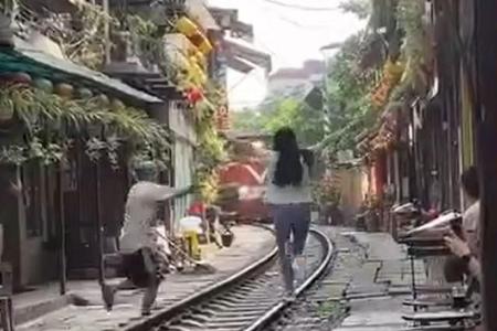 Cafe owner fined after foreign tourist seen close to oncoming train