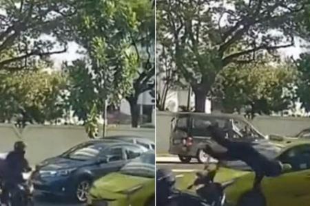 Motorcyclist flung into the air in collision with taxi