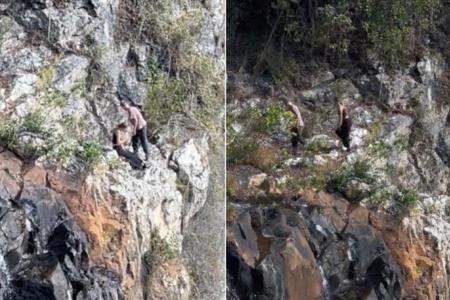 2 hikers who perched on narrow cliff ledge in Queensland national park cheat death