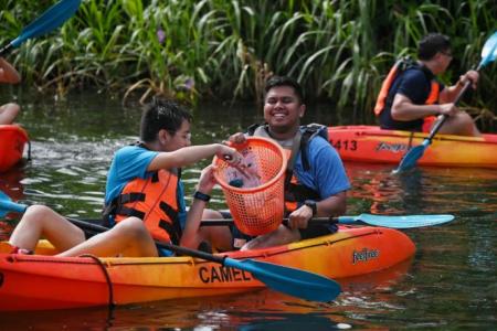 Dragon boaters and S'pore Children's Society beneficiaries team up to clean Lower Seletar Reservoir