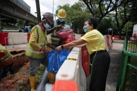 Volunteer opens her home to be charity's collection point for gifts to migrant workers