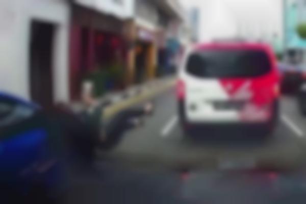 Woman using mobile phone while crossing Lavender Street hit by taxi