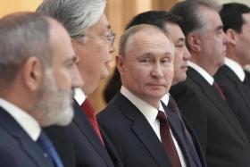 Mr Putin (centre) gave eight golden rings to Moscow-allied leaders of post-Soviet countries.