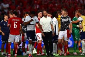 Southgate (centre) said the key to England’s failings against a combative and intelligent Danish side was their failure to press hard enough and a lack of quality on the ball.