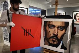 A self-portrait by actor Johnny Depp is pictured at Castle Fine Art Gallery in London.