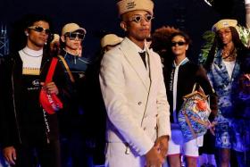 Musician Pharrell Williams appearing at the end of Louis Vuitton's first Men's Pre-Fall 2024 Show in Hong Kong on Nov 30. 