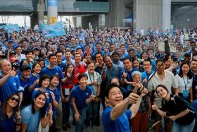 DPM Lawrence Wong taking a "wefie" with participants at a Singapore World Water Day event at Marina Barrage in March 2023.