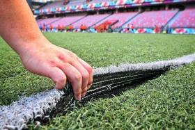 A ripped patch is seen at the  pitch at Our Tampines Hub taken on April 11, 2023. 