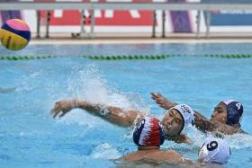 Singapore&#039;s water polo team on their way to a 12-5 win over Indonesia at the SEA Games on Sunday.