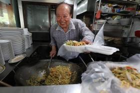 Mr Tan Kue Kim was known to fry Hokkien mee while donning a Rolex watch and long-sleeved shirt.