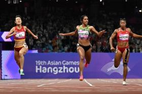 Shanti Pereira (centre) said she is aiming to advance from the heats in her events.