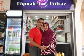 Mr Asanul Fariq Sani and his wife Norhasyimah Awaludin at their minimart in Tampines. 