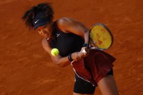 Japan&#039;s Naomi Osaka in action during her round of 128 match against Belgium&#039;s Greet Minnen.