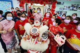 Health Minister Ong Ye Kung (centre) visiting patients and staff of Tan Tock Seng Hospital on the first day of the Chinese New Year, on Feb 10.
