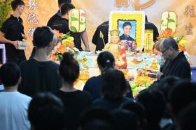 Friends and relatives of Captain Kenneth Tay Xue Qin paying their respects to him on May 17.