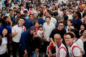 PM Lawrence Wong (centre) with residents at the Tampines Learning Festival 2024, held at Tampines Community Plaza on June 15.