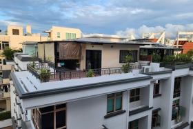 One of the structures in question, at the four-storey Rose Maison, appears to be a glass-enclosed space with an extended roof sheltering part of the terrace.