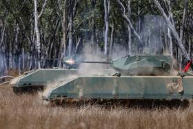 The Singapore Army’s Hunter armoured fighting vehicle in a live-firing drill during Exercise Wallaby in Australia.