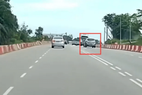 The vehicle can be seen driving along the opposite lane before swerving back into the correct lane as it nears other vehicles.