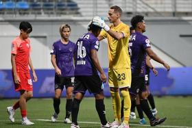 Tanjong Pagar United goalkeeper Matt Silva patting Raihan Rahman on the head after the 1-1 draw with the Young Lions.