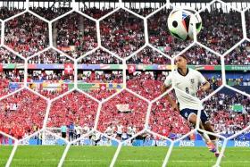 England&#039;s defender Trent Alexander-Arnold scoring the winning penalty during the Euro 2024 quarter-final win over Switzerland on July 6.