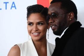 Cassie and rap mogul Sean Combs at a party on the eve of the 60th Annual Grammy Awards in 2018.