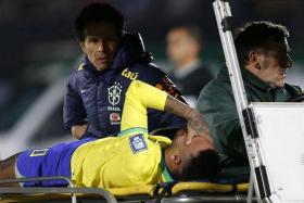 Soccer Football - World Cup - South American Qualifiers - Uruguay v Brazil - Estadio Centenario, Montevideo, Uruguay - October 17, 2023 Brazil's Neymar is brought off the pitch after sustaining an injury REUTERS/Andres Cuenca