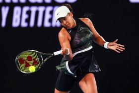 FILE PHOTO: Jan 15, 2024; Melbourne, Victoria, Australia; Naomi Osaka of Japan plays a shot against Caroline Garcia (not pictured) of France in Round 1 of the Women's Singles on Day 2 of the Australian Open tennis at Rod Laver Arena./Mike Frey-USA TODAY Sports/File Photo