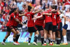 Manchester United players celebrate after winning the women&#039;s FA cup on May 12.