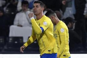 Al Nassr&#039;s Cristiano Ronaldo celebrating after scoring  their first goal against Al Shabab.