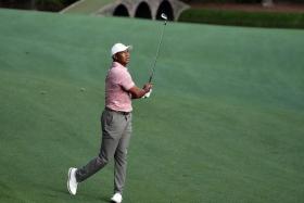 Apr 11, 2024; Augusta, Georgia, USA; Tiger Woods hits his third shot on No. 13 during the first round of the Masters Tournament. Mandatory Credit: Rob Schumacher-USA TODAY Network