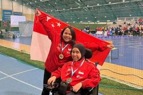 Nurulasyiqah Mohd Taha (right) and her athlete competition partner, Nur Azizah.