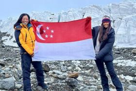 Ms Sim Phei Sunn (left) and Ms Vincere Zeng at the summit of K2 on July 27.
