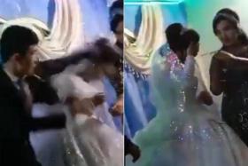 The footage showed the bride visibly distressed by the assault, as loud applause greeted her victory in the game.