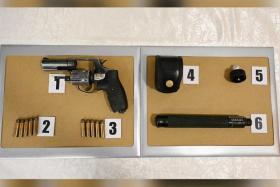 The man had been carrying a fully-loaded Taurus revolver, which had five bullets, a speed loader with another five bullets, and a baton in a pouch. 
