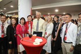 Minister for Defence Ng Eng Hen (centre) with principal partners at an NDP appreciation function at Gardens by the Bay, on Aug 17.