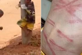 Two people have been arrested in China after a 10-year-old boy, who is suspected of theft, was tied to a telephone pole and flogged by fellow villagers.