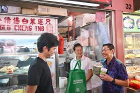 Minister in the Prime Minister&#039;s Office Maliki Osman (right) launched the East Coast Green Savers initiative at Bedok Food Centre on Dec 7.