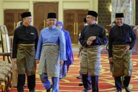 Malaysia's King, Sultan Abdullah Ahmad Shah (second from left), PM Anwar Ibrahim (third from left), DPM Fadillah Yusof (left) and DPM Zahid Hamidi at the national palace on Dec 2.
