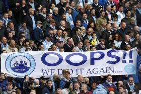 WE DID IT: Man City fans celebrating their league triumph yesterday.  