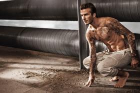 David Beckham posing for his new collection at H&amp;M.