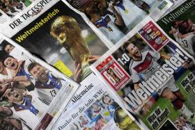 The front pages of German newspapers announcing Germany&#039;s champion title after German national football team won their FIFA World Cup 2014 final game against Argentina in Brazil. 