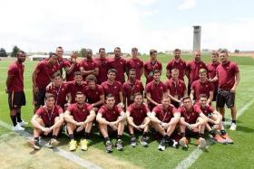 Former Chelsea defender Ashley Cole (extreme left) has become the target of Internet pranksters for his awkward pose in this photo with his new team Roma. 