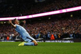 DOUBLE UP: Stevan Jovetic sending Man City on the way to an emphatic win.  