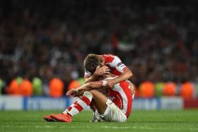 RELIEF: Nacho Monreal (above) hugging Alexis Sanchez at the final whistle after Arsenal scraped into the group stages of the Champions League, thanks to the latter&#039;s goal. 